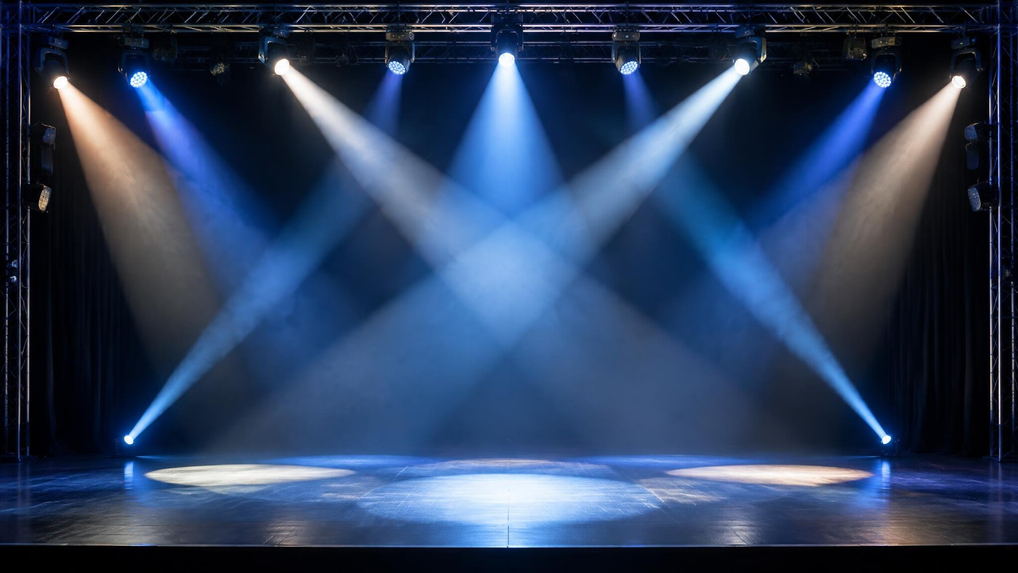 Spotlights above a stage creating bright beams