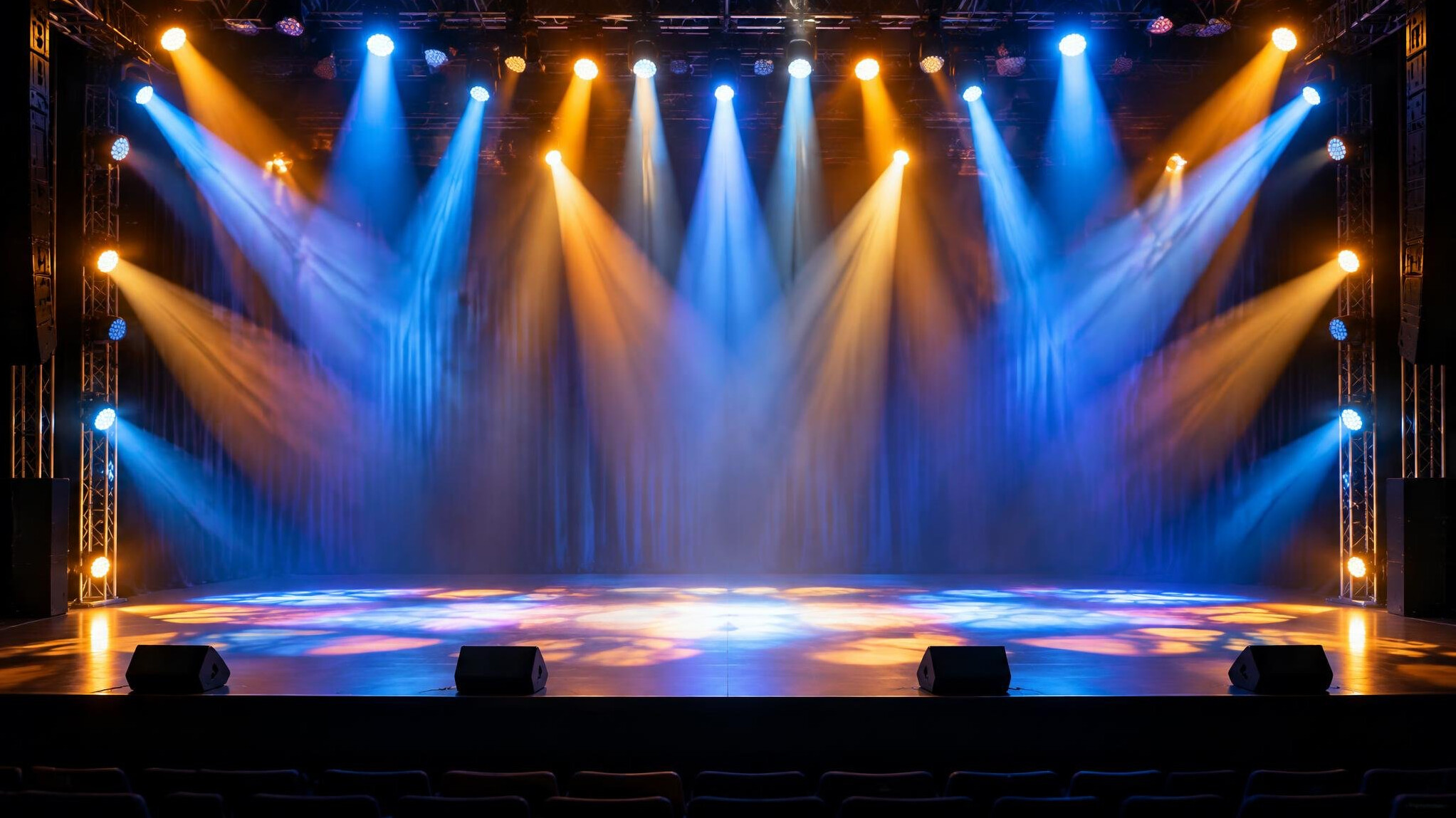 Stage lights shining over an entertainment venue